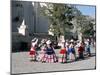 Girls in Traditional Local Dress Dancing in Square at Yanque Village, Colca Canyon, Peru-Tony Waltham-Mounted Photographic Print