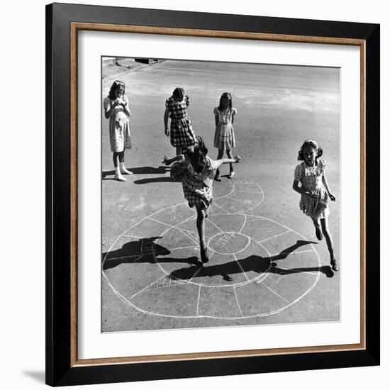 Girls Playing Hopscotch in the Street-Ralph Morse-Framed Photographic Print