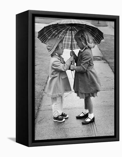 Girls Sharing an Umbrella-Josef Scaylea-Framed Premier Image Canvas