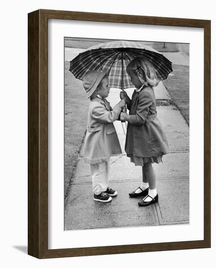 Girls Sharing an Umbrella-Josef Scaylea-Framed Photographic Print