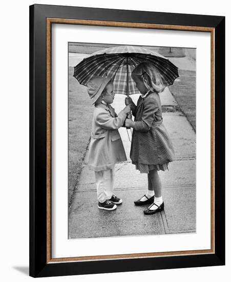 Girls Sharing an Umbrella-Josef Scaylea-Framed Photographic Print