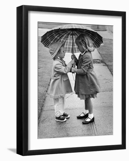 Girls Sharing an Umbrella-Josef Scaylea-Framed Photographic Print