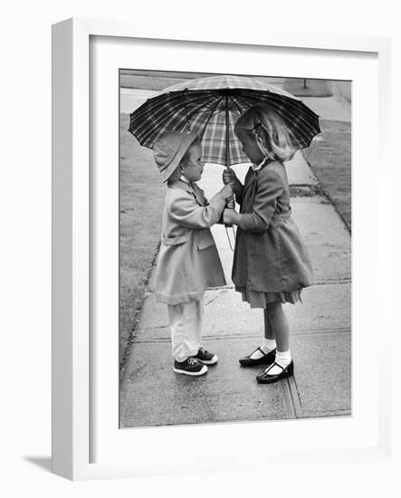 Girls Sharing an Umbrella-Josef Scaylea-Framed Photographic Print