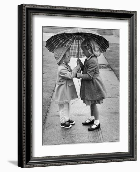 Girls Sharing an Umbrella-Josef Scaylea-Framed Photographic Print