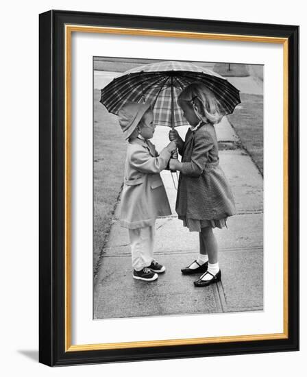 Girls Sharing an Umbrella-Josef Scaylea-Framed Photographic Print