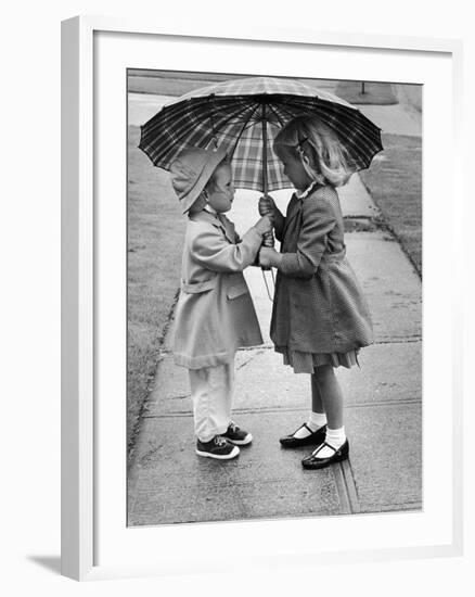 Girls Sharing an Umbrella-Josef Scaylea-Framed Photographic Print