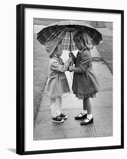 Girls Sharing an Umbrella-Josef Scaylea-Framed Photographic Print