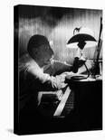 Young Bassist Member of Alexander Schneider's New York String Orchestra Tuning His Instrument-Gjon Mili-Photographic Print