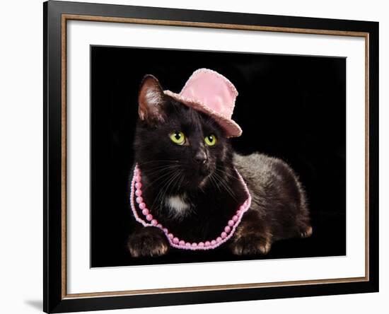 Glamorous Black Cat Wearing Pink Hat And Beads Against Black Background-vitalytitov-Framed Photographic Print