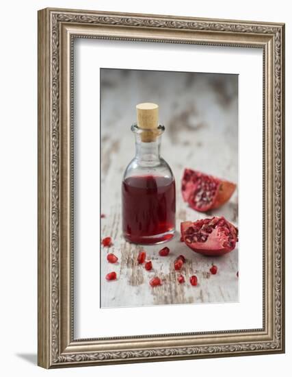 Glass Bottle with Pomegranate Juice and Pomegranate-Jana Ihle-Framed Photographic Print