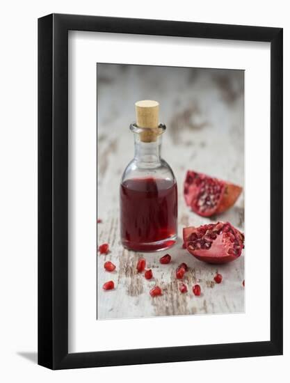 Glass Bottle with Pomegranate Juice and Pomegranate-Jana Ihle-Framed Photographic Print