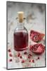 Glass Bottle with Pomegranate Juice and Pomegranate-Jana Ihle-Mounted Photographic Print