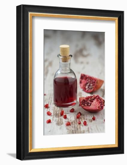 Glass Bottle with Pomegranate Juice and Pomegranate-Jana Ihle-Framed Photographic Print