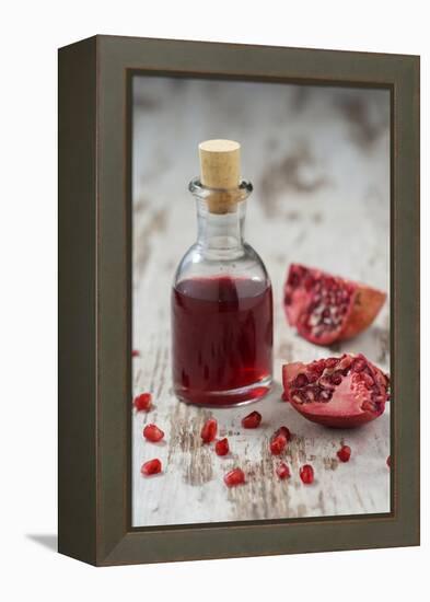 Glass Bottle with Pomegranate Juice and Pomegranate-Jana Ihle-Framed Premier Image Canvas