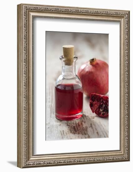 Glass Bottle with Pomegranate Juice and Pomegranate-Jana Ihle-Framed Photographic Print