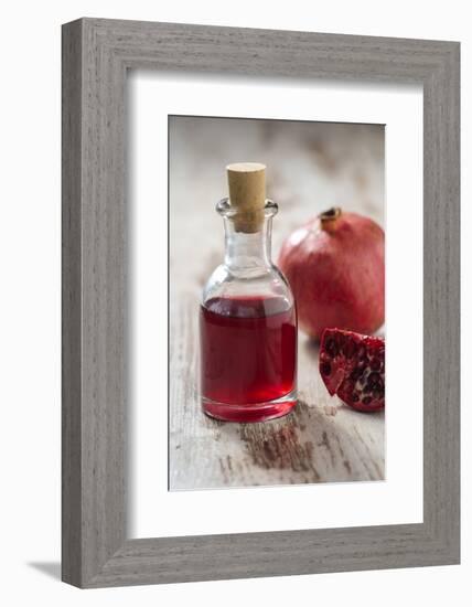 Glass Bottle with Pomegranate Juice and Pomegranate-Jana Ihle-Framed Photographic Print