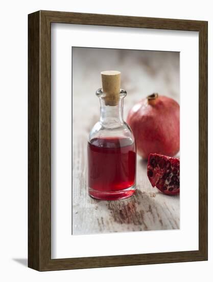 Glass Bottle with Pomegranate Juice and Pomegranate-Jana Ihle-Framed Photographic Print