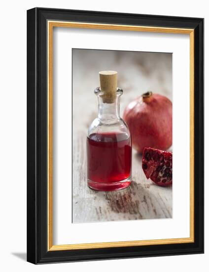 Glass Bottle with Pomegranate Juice and Pomegranate-Jana Ihle-Framed Photographic Print