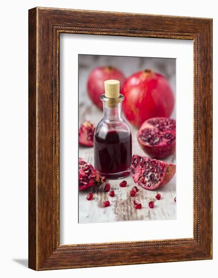 Glass Bottle with Pomegranate Juice and Pomegranates-Jana Ihle-Framed Photographic Print