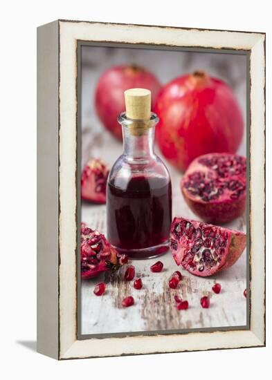 Glass Bottle with Pomegranate Juice and Pomegranates-Jana Ihle-Framed Premier Image Canvas