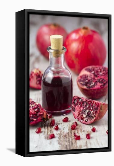 Glass Bottle with Pomegranate Juice and Pomegranates-Jana Ihle-Framed Premier Image Canvas