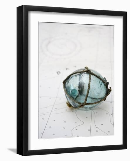 Glass fishing float on chart-Savanah Plank-Framed Photo