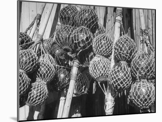 Glass Net Floats Being Used in Groups to Hold Afloat Net Markers Which Are Poles with Small Flag-Eliot Elisofon-Mounted Photographic Print