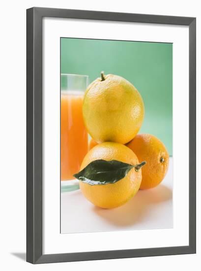 Glass of Orange Juice Beside Several Oranges-Foodcollection-Framed Photographic Print