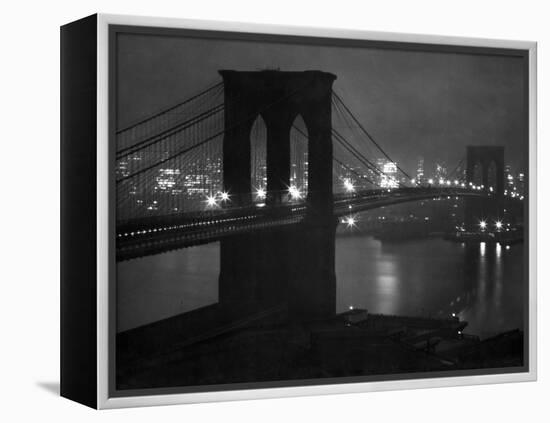 Glittering Night View of the Brooklyn Bridge Spanning the Glassy Waters of the East River-Andreas Feininger-Framed Premier Image Canvas