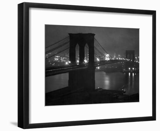 Glittering Night View of the Brooklyn Bridge Spanning the Glassy Waters of the East River-Andreas Feininger-Framed Photographic Print