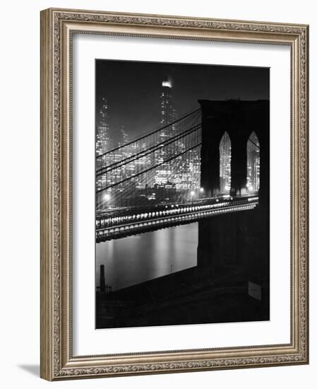 Glittering Night View of the Brooklyn Bridge Spanning the Glassy Waters of the East River-Andreas Feininger-Framed Photographic Print