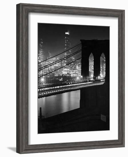 Glittering Night View of the Brooklyn Bridge Spanning the Glassy Waters of the East River-Andreas Feininger-Framed Photographic Print