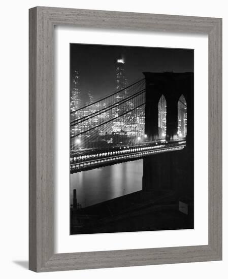 Glittering Night View of the Brooklyn Bridge Spanning the Glassy Waters of the East River-Andreas Feininger-Framed Photographic Print