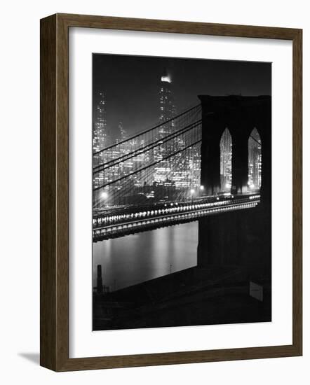 Glittering Night View of the Brooklyn Bridge Spanning the Glassy Waters of the East River-Andreas Feininger-Framed Photographic Print