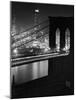 Glittering Night View of the Brooklyn Bridge Spanning the Glassy Waters of the East River-Andreas Feininger-Mounted Photographic Print