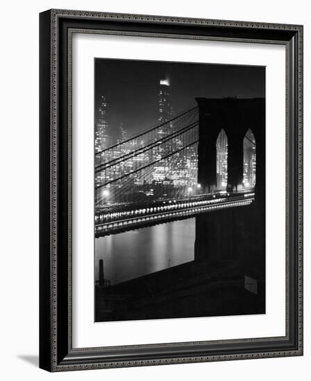 Glittering Night View of the Brooklyn Bridge Spanning the Glassy Waters of the East River-Andreas Feininger-Framed Photographic Print