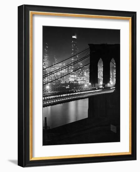 Glittering Night View of the Brooklyn Bridge Spanning the Glassy Waters of the East River-Andreas Feininger-Framed Photographic Print