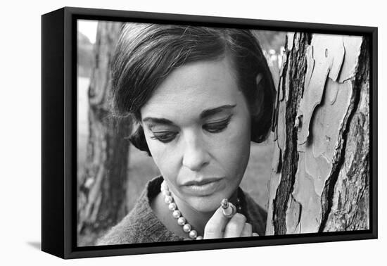 Gloria Vanderbilt Smoking Outside and Showing New Hairdo, 1963-Paul Schutzer-Framed Premier Image Canvas