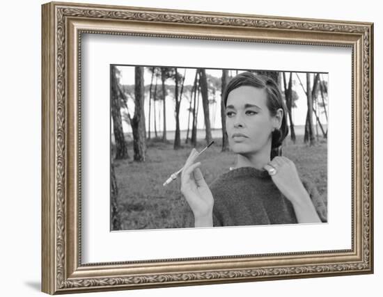 Gloria Vanderbilt Smoking Outside and Showing New Hairdo, 1963-Paul Schutzer-Framed Photographic Print