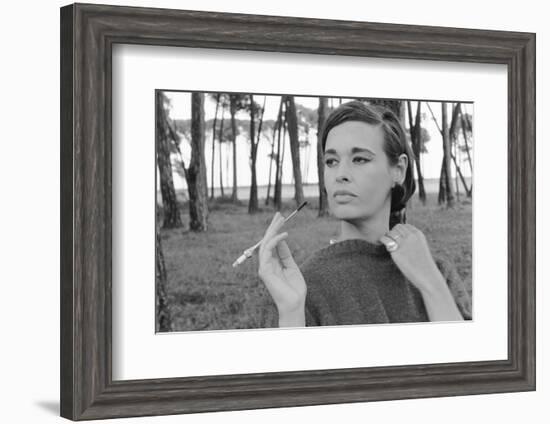 Gloria Vanderbilt Smoking Outside and Showing New Hairdo, 1963-Paul Schutzer-Framed Photographic Print