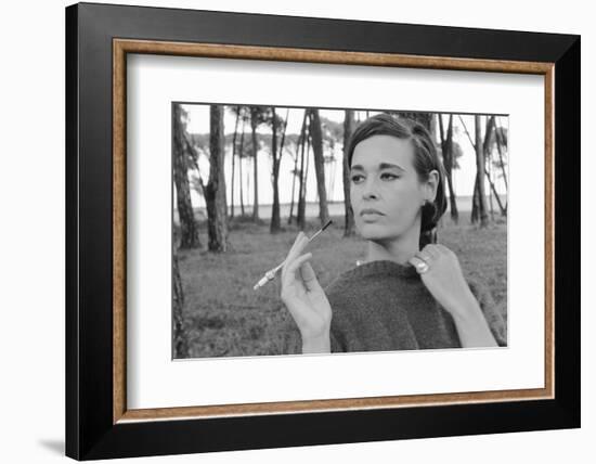 Gloria Vanderbilt Smoking Outside and Showing New Hairdo, 1963-Paul Schutzer-Framed Photographic Print