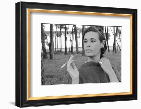 Gloria Vanderbilt Smoking Outside and Showing New Hairdo, 1963-Paul Schutzer-Framed Photographic Print