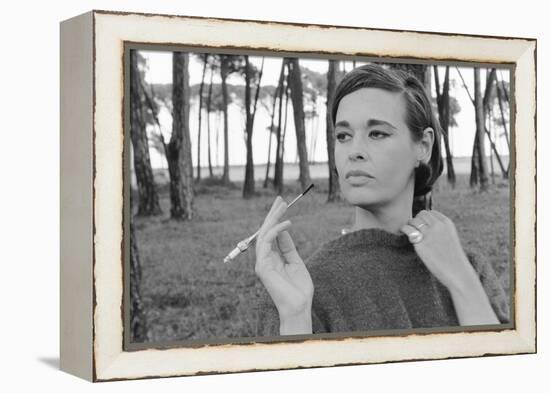 Gloria Vanderbilt Smoking Outside and Showing New Hairdo, 1963-Paul Schutzer-Framed Premier Image Canvas