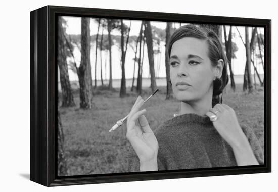 Gloria Vanderbilt Smoking Outside and Showing New Hairdo, 1963-Paul Schutzer-Framed Premier Image Canvas