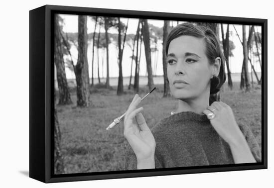 Gloria Vanderbilt Smoking Outside and Showing New Hairdo, 1963-Paul Schutzer-Framed Premier Image Canvas