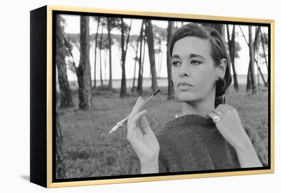 Gloria Vanderbilt Smoking Outside and Showing New Hairdo, 1963-Paul Schutzer-Framed Premier Image Canvas