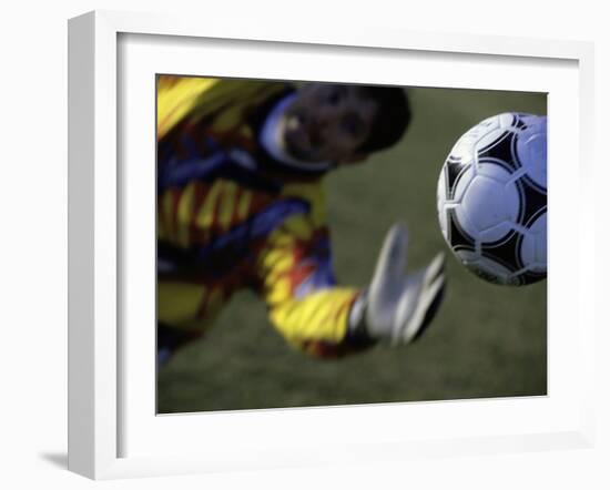 Goalie Attempting to Stop a Soccer Ball-null-Framed Photographic Print