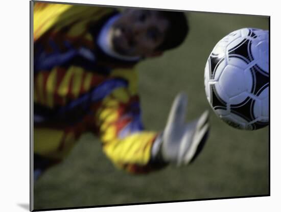 Goalie Attempting to Stop a Soccer Ball-null-Mounted Photographic Print