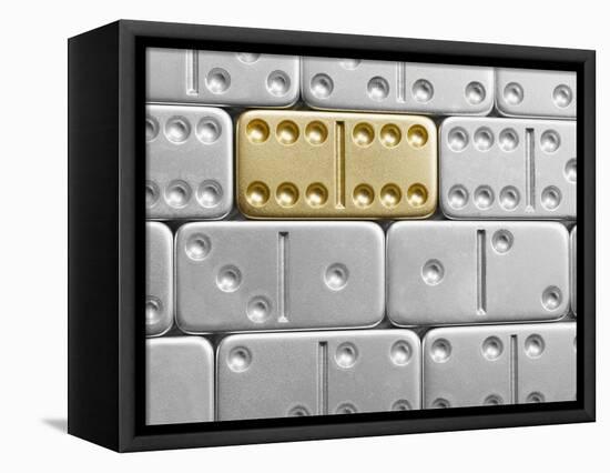 Gold domino amid silver dominoes-null-Framed Premier Image Canvas