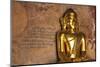 Golden Buddha Statue in Front of Burmese Writing on Wall, Bagan, Myanmar-Harry Marx-Mounted Photographic Print